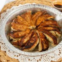 Pan-Fried Dumplings (Gyoza) · pork, chicken, cabbage, chive, garlic, ginger
