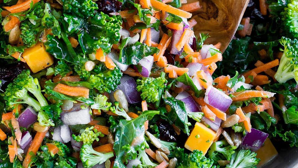 Side Kale Salad · Massaged kale, roasted sweet potato, shredded carrot, red onion, cranberries, olive oil and lemon.