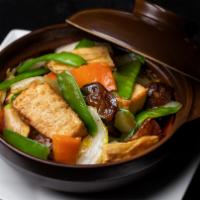 Hometown Braised Tofu · Tofu cubes soft inside, crispy outside braised with bok choy, baby bamboo shoots, white, and...