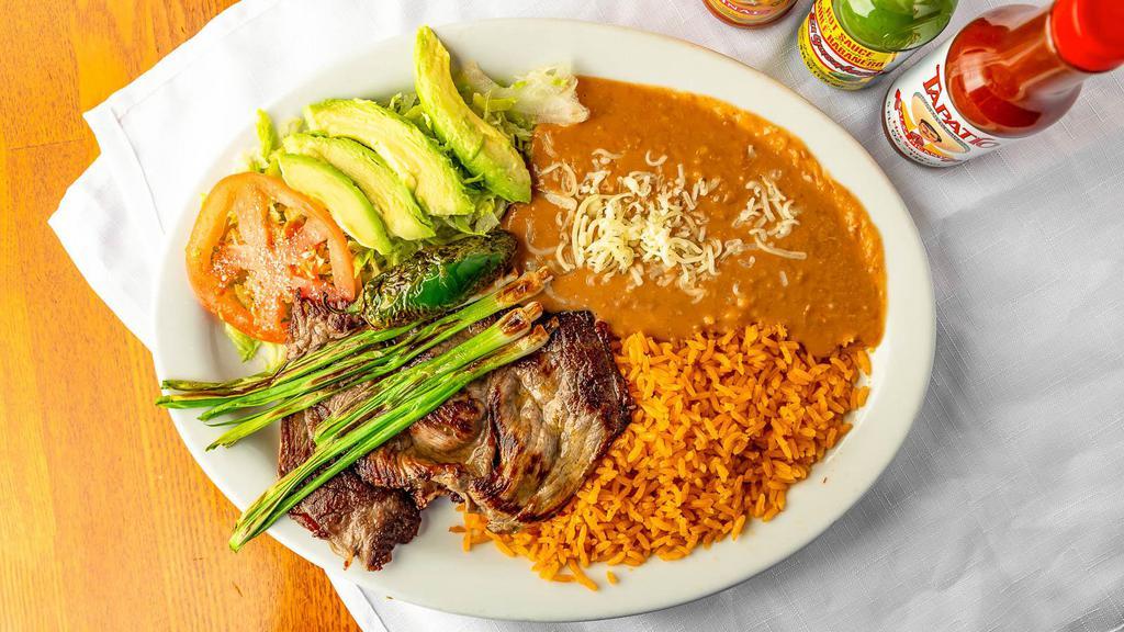 Carne Asada Plate · Steak with grilled jalapenos, green onions, and sliced avocado