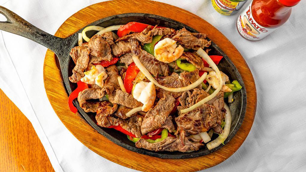 Fajitas Mixtas · Beef and shrimp. with fajita vegetables. Side of Rice, Beans, Lettuce, Sour Cream and Guacamole