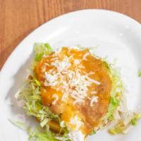 Sopes · A thick and consistent fried corn tortilla with beans, lettuce,sour cream,cheese,salsa and m...
