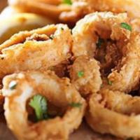 Calamari Ring Curry · Breaded calamari rings fried to perfection. Served with curry and rice.