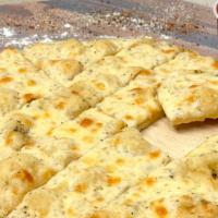 Cheesy Garlic Bread  · Cheesy garlic bread is a great appetizer that comes with a side of our in house pizza sauce.
