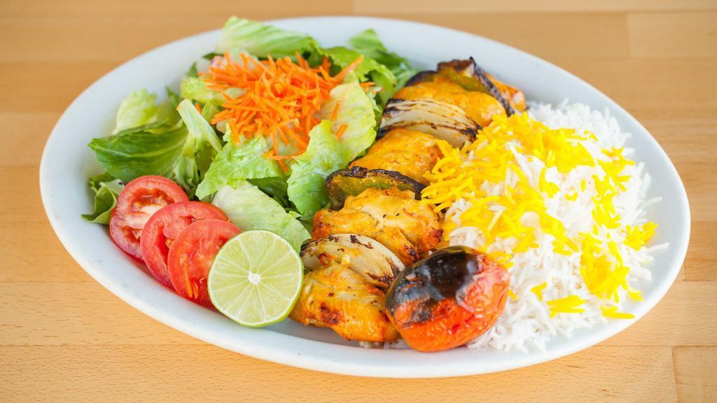 Chicken Kabob · Grilled pieces of chicken breast marinated in lemon juice and saffron with bell peppers and onion.