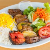 Shish Kabob · Grilled pieces of all-natural filet mignon marinated with bell pepper and onion.