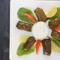 Dolmeh · Vegetarian. Six pieces of stuffed grape leaves with rice, fresh herbs, and spices. Served wi...