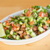 Shirazi Salad · Vegetarian. Chopped Persian cucumber, tomato, and parsley, with lemon-mint dressing.