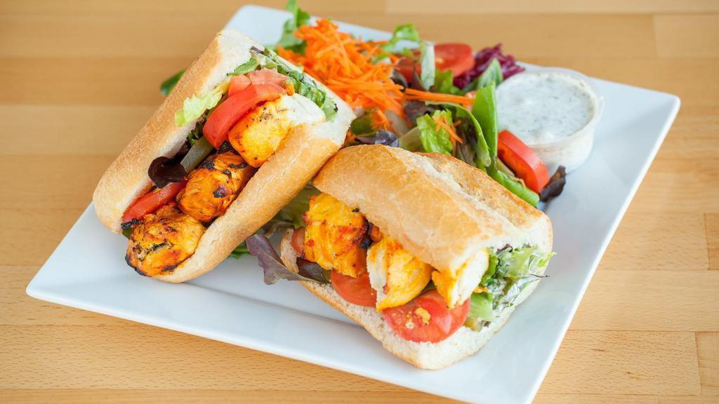 Grilled Chicken Sandwich · Grilled marinated chicken breast with lettuce, tomato, pickles, and house dressing. Served in French baguette with a choice of green salad or French fries.