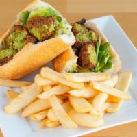 Falafel Sandwich · Vegetarian. Vegetarian patties with lettuce, tomato, pickle, and house dressing. Served in F...