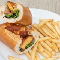 Chicken Cutlet Sandwich · Seasoned ground chicken and potato with lettuce, tomato, pickles, and house dressing. Served...