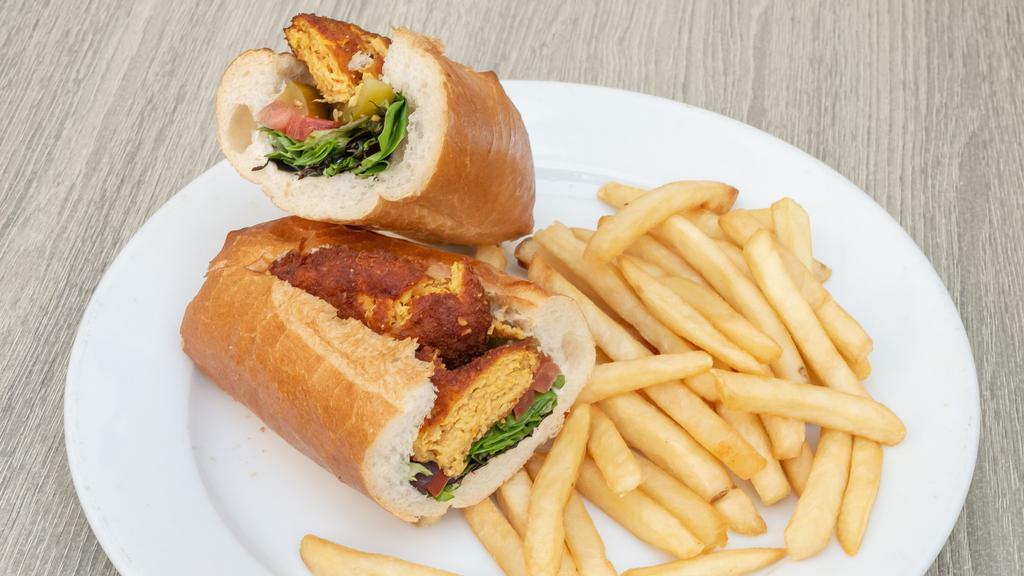 Chicken Cutlet Sandwich · Seasoned ground chicken and potato with lettuce, tomato, pickles, and house dressing. Served in French baguette with a choice of green salad or French fries.