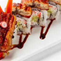Dragon Roll · Eel and cucumber inside with avocado and tobiko on top with eel sauce