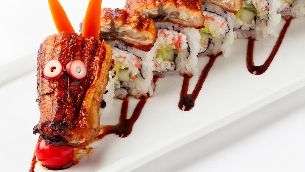 Dragon Roll · Eel and cucumber inside with avocado and tobiko on top with eel sauce