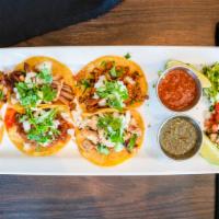 Taco Sampler · 6 street tacos: Asada, chicken, pastor. Topped w/ cilantro, onions & salsa. Side of guacamol...