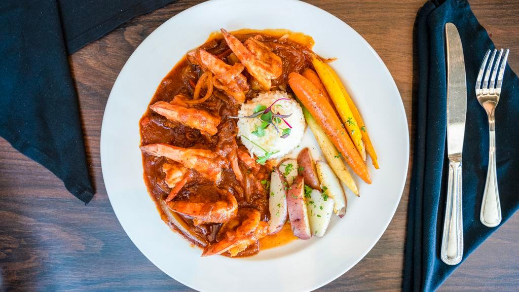 Camarones Rancheros · Shrimp sautéed in butter, Spanish sauce, onions, tomatoes & bell peppers. Served with white rice & vegetables.