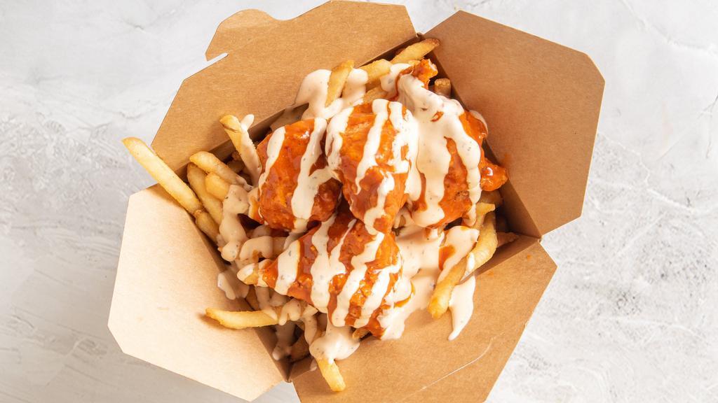 Buffalo | Jaguar Chicken Fries · Favorite. Box of seasoned fries
topped with four deep fried chicken chunks
crossed with our signature jag-ranch.