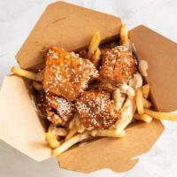 Sesame Honey | Jaguar Chicken Fries · Box of seasoned fries
topped with four deep fried chicken chunks
crossed with our signature ...