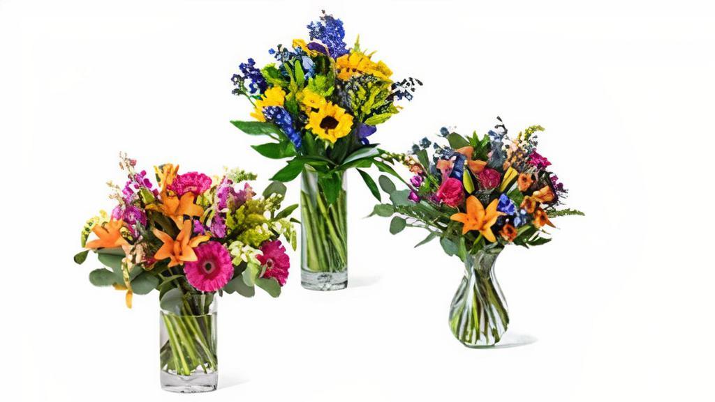 Seasonal Mixed Flower Arrangement · Beautiful seasonal flowers arranged in a clear vase. 15-20 stems.