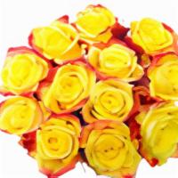 Dozen Long Stem Yellow Or Orange Roses  · Dozen roses wrapped in clear cellophane.