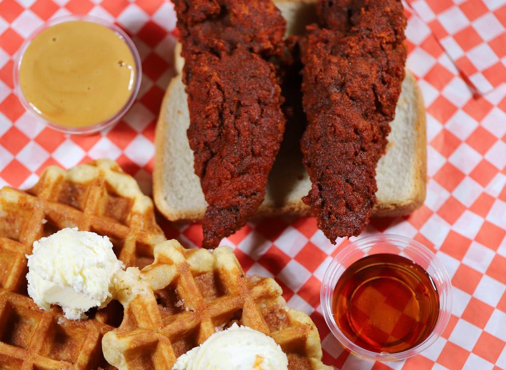 2 Waffles + 2 Chicken Strips · Two waffles, two chicken strips, butter and syrup