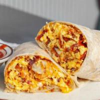 Siggy'S Breakfast Burrito · 3 eggs, hash browns, shredded jack/cheddar cheese mix,  ham, bacon AND sausage, salsa on the...