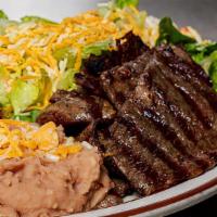 Carne Asada Dinner · Served with  mexican rice, beans, guacamole, sour cream, salsa, dinner salad with choice of ...