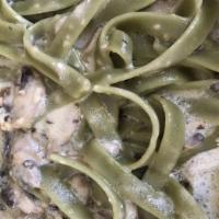 Chicken Fettuccine Alfredo · Festive green fettuccine noodles tossed in a buttery alfredo cream sauce. Add vegetables or ...