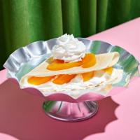 Peaches And Cream Crepe · Fresh sweet whipped cream and juicy peaches wrapped in a warm crepe.