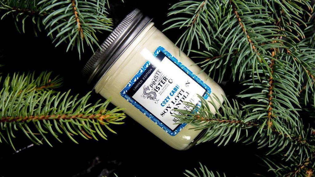 Cozy Cabin Soy Lotion Candle · Cuddle up, get cozy, and envelop yourself in the warm rustic scent as this candle flickers. Then rub the silky melted oils of our Soy Lotion Candle right onto your skin to soak up the coziness even more. Limited edition scent!