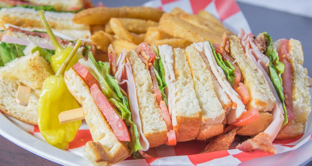 Club Sandwich · Triple stacked sandwich with turkey, ham, lettuce, bacon, tomato.