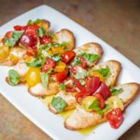 Bruschetta · Toasted baguette with smoked mozzarella, heirloom tomatoes, basil and garlic.