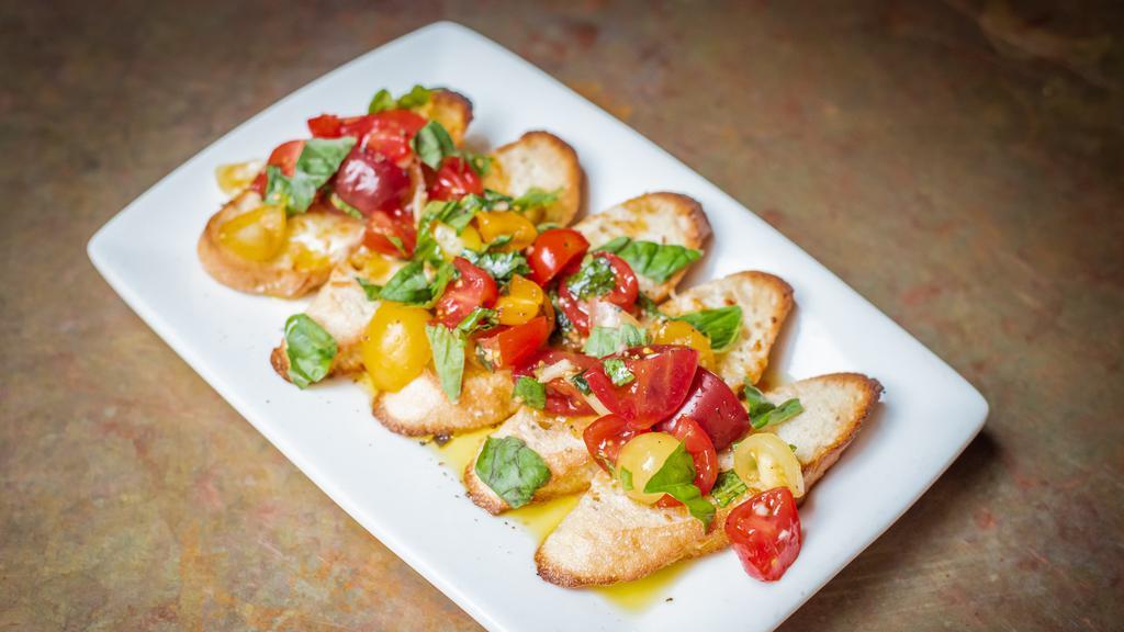 Bruschetta · Toasted baguette with smoked mozzarella, heirloom tomatoes, basil and garlic.