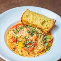 Cappellini Pomodoro · Angel hair with tomatoes, basil, toasted garlic, olive oil, and Parmesan.