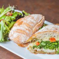 Grilled Chicken Sandwich · Provolone, oven roasted tomatoes, caramelized onions, arugula, basil aioli, served on an art...
