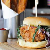 Fried Chicken Sandwich · Fried chicken breast, kale & cabbage slaw, poppyseed dressing, mayo, tomato, pickles, onion....