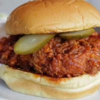 Nashville Hot Chicken · Nashville-style fried chicken, spicy pepper marinade, pickles.  Served on a potato bun with ...