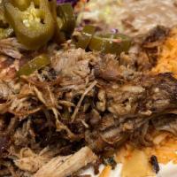 Carnitas - Plate · Our Signature braised pork carnitas prepared and cooked Michoacán style.