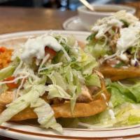 Sopes - Plate · Made with our house-mixed masa and deep-fried to order. Your choice of meat, a base of re-fi...