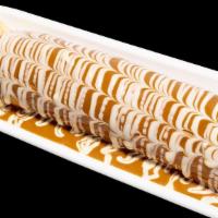 Banana Roll · a fresh banana wrapped in a thin tender crepe served with your choice of topping