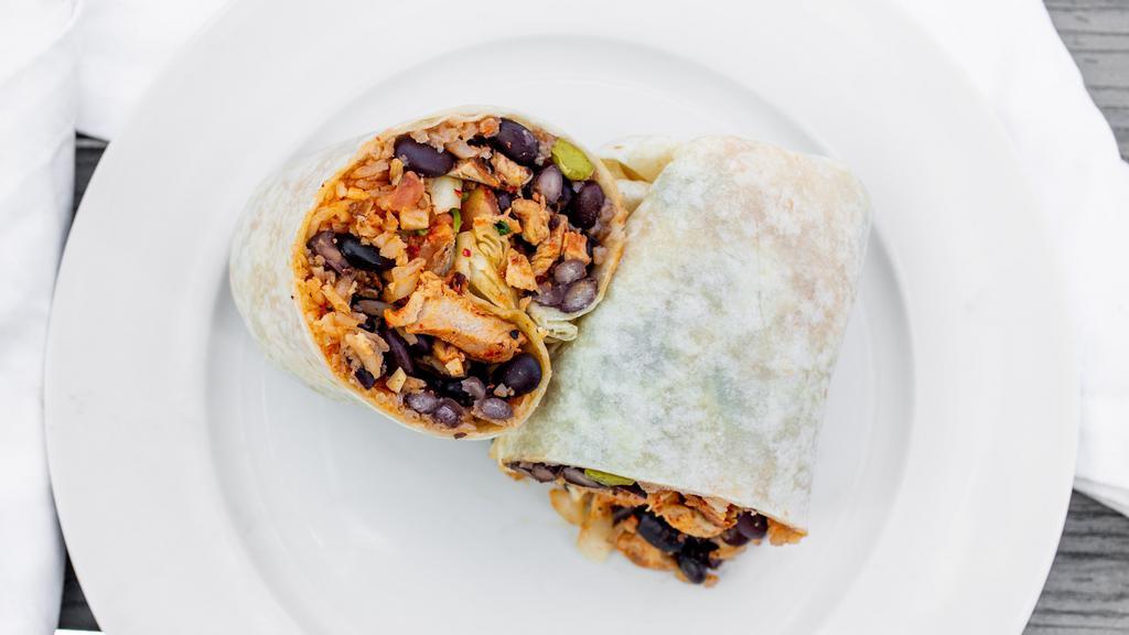Chicken Burrito · Burrito stuffed with rice, beans, cllantro, tomatoes, onion, green salsa, and grilled chicken breast.