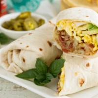Chorizo Breakfast Burrito · Beef chorizo, eggs, house made hash browns, cheese, onions, and hot sauce rolled into a warm...
