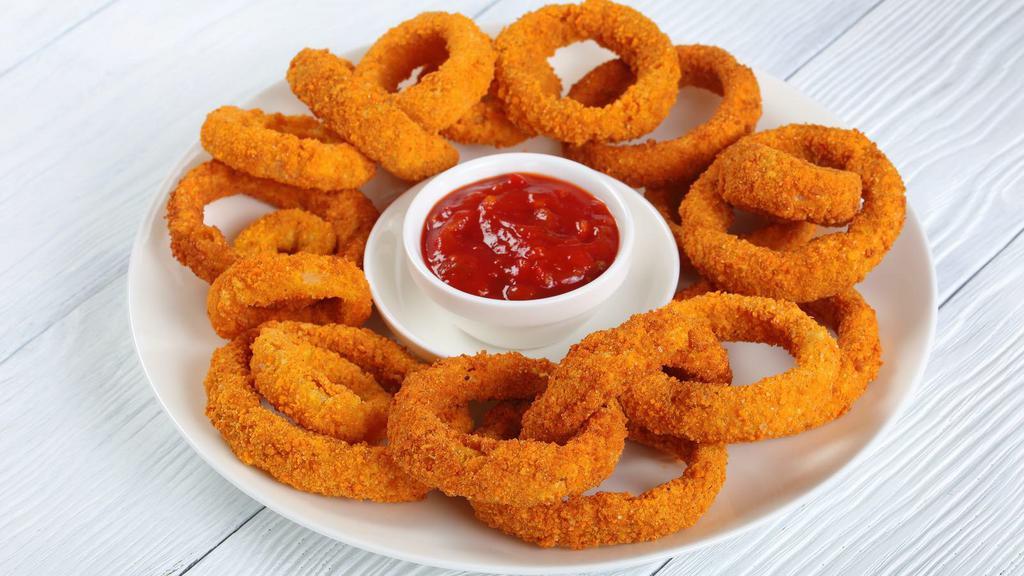 Onion Rings · Thick-cut onion rings made from whole white onions, battered with a subtle blend of spices.
