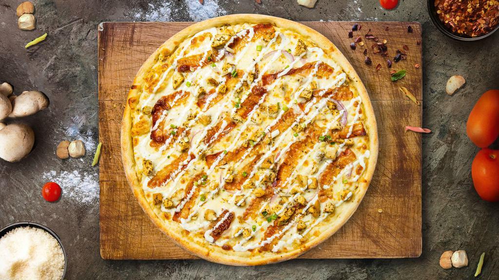 Superb Garlic Chicken Pizza · Creamy garlic sauce, real bacon, healthy portion of chicken, cheddar cheese, mozzarella cheese, red onions, garlic, and green onions.