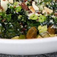 Kale Salad · Tossed romaine lettuce, kale, golden raisins, toasted almonds, organic red quinoa, American ...