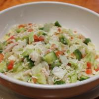 Chopped Salad · Chopped turkey breast, romaine, crisp iceberg, garbanzo beans, cucumbers, roma tomatoes and ...
