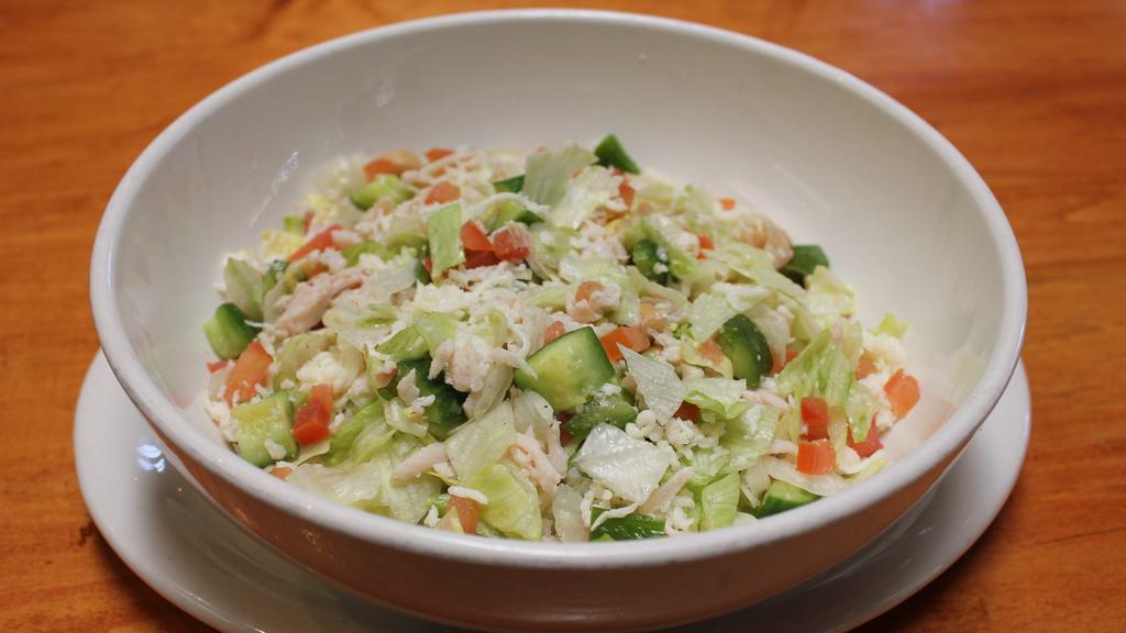 Chopped Salad · Chopped turkey breast, romaine, crisp iceberg, garbanzo beans, cucumbers, roma tomatoes and mozzarella cheese with red wine vinaigrette.