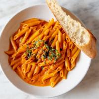 Penne Arrabiata · Penne pasta tossed with a spicy house made tomato sauce, fresh garlic, fresh basil and a tou...