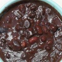 Frijoles 🥣 · Black beans slowly cooked with onions, bell peppers, garlic, cumin, black pepper, and bay le...