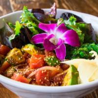 Ahi Poke Bowl. · Marinated tuna, spring mix, avocado, red onion, seaweed salad, pickled ginger on top of whit...